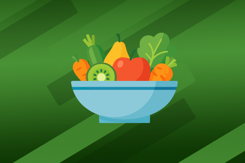 a blue bowl hold fruits and vegetables such as apples, carrots, and leaf lettuce